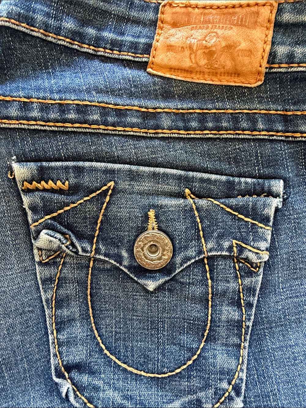 True religion Brand Blue Denim Jeans with Tan Stitching and Leather Patch
